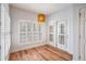 Cozy living area with wood floors, natural light, and shuttered windows at 50 Biscayne Nw Dr # 5112, Atlanta, GA 30309