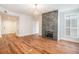 Open-concept living area with hardwood floors and modern fireplace for comfortable living at 50 Biscayne Nw Dr # 5112, Atlanta, GA 30309