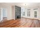 Bright living room with hardwood floors, fireplace, and a door to the outside at 50 Biscayne Nw Dr # 5112, Atlanta, GA 30309