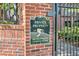 Brick wall with sign: Private Property, No Trespassing, Cameras in Use; property is monitored at 50 Biscayne Nw Dr # 5112, Atlanta, GA 30309