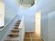 Bright foyer with an unfinished staircase and natural light flooding the space at 66 Pine Creek Ct, Dallas, GA 30157