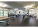 Bright fitness center equipped with treadmills, weights, and exercise machines at 240 Renaissance Ne Pkwy # 112, Atlanta, GA 30308