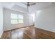 Spacious bedroom featuring hardwood floors and a large window at 2411 Charleston Oaks Ln, Decatur, GA 30030