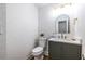 Stylish powder room featuring a modern vanity, gold accents, and chic patterned wallpaper at 2411 Charleston Oaks Ln, Decatur, GA 30030