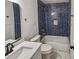 Modern bathroom with stylish blue tiled shower, sleek fixtures, and contemporary design at 1330 Lanvale Sw Dr, Atlanta, GA 30310