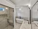 Beautiful bathroom featuring double vanity, soaking tub, glass enclosed shower, and modern finishes at 1330 Lanvale Sw Dr, Atlanta, GA 30310
