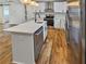 Well-equipped kitchen with an island, stainless steel dishwasher, and plenty of counter space at 1330 Lanvale Sw Dr, Atlanta, GA 30310