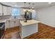 Stylish kitchen with an island, stainless steel appliances, and modern pendant lighting at 1330 Lanvale Sw Dr, Atlanta, GA 30310