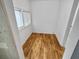 Bright room featuring wood floors, white walls and trim, plus natural light from two windows at 1330 Lanvale Sw Dr, Atlanta, GA 30310