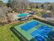 A scenic community view shows the pool, tennis courts, clubhouse, and landscaping, perfect for recreation at 215 Morning Glory Rdg, Canton, GA 30115
