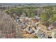 Aerial view of neighborhood showing mature trees and rolling hills at 215 Morning Glory Rdg, Canton, GA 30115
