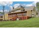 Large backyard featuring a screened-in porch and a spacious green lawn, perfect for enjoying the outdoors at 215 Morning Glory Rdg, Canton, GA 30115