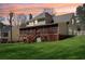 Spacious backyard featuring a screened-in porch and lush green grass, ideal for outdoor living at 215 Morning Glory Rdg, Canton, GA 30115