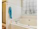 Close up of soaking tub and window with horizontal blinds in bathroom at 215 Morning Glory Rdg, Canton, GA 30115