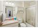 Bathroom featuring a granite vanity, a white cabinet, and a glass shower with a frosted glass door at 215 Morning Glory Rdg, Canton, GA 30115