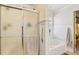 Bathroom showcasing glass enclosed shower and soaking tub with bright natural light at 215 Morning Glory Rdg, Canton, GA 30115