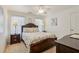 Bedroom featuring a queen size bed, side tables, and neutral decor at 215 Morning Glory Rdg, Canton, GA 30115