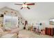 Bonus room with built-in shelves, a desk, sewing machine, and a pink rug at 215 Morning Glory Rdg, Canton, GA 30115