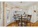 Charming breakfast nook with a table and four chairs by the windows at 215 Morning Glory Rdg, Canton, GA 30115