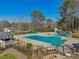 Aerial view of the community pool featuring a slide and clubhouse, perfect for recreation and relaxation at 215 Morning Glory Rdg, Canton, GA 30115
