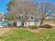 Charming clubhouse by a community pool featuring a thrilling water slide for residents to enjoy on sunny days at 215 Morning Glory Rdg, Canton, GA 30115