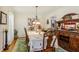 Formal dining room with a long table, seating for eight, and a decorative buffet at 215 Morning Glory Rdg, Canton, GA 30115