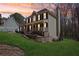 Attractive two-story home with a charming front porch, well-maintained lawn, and a serene neighborhood setting at 215 Morning Glory Rdg, Canton, GA 30115