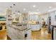 Bright kitchen features granite countertops, brick accents, open layout and stainless steel appliances at 215 Morning Glory Rdg, Canton, GA 30115