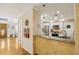 Open kitchen featuring brick accents, granite countertops, stainless steel appliances, and hardwood floors at 215 Morning Glory Rdg, Canton, GA 30115