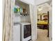 Convenient laundry closet next to a main bedroom with new washer and dryer at 215 Morning Glory Rdg, Canton, GA 30115