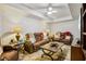 Cozy living room features leather reclining seating, ceiling fan, and modern design at 215 Morning Glory Rdg, Canton, GA 30115