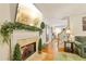 Bright living room featuring a fireplace, hardwood floors, and staircase at 215 Morning Glory Rdg, Canton, GA 30115