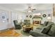 Inviting living room with fireplace, hardwood floors, and comfortable seating at 215 Morning Glory Rdg, Canton, GA 30115