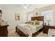 Serene main bedroom with plush carpeting, ample natural light, and classic wood furnishings at 215 Morning Glory Rdg, Canton, GA 30115