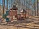 A well-maintained playground invites children to play on its slide and climbing structures in a wooded setting at 215 Morning Glory Rdg, Canton, GA 30115