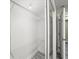 Walk-in closet with wire shelving, gray wood-look floors, and sliding doors at 3087 Colonial Way # J, Atlanta, GA 30341