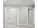 Open closet with shelving, gray wood-look floors, neutral paint and white trim at 3087 Colonial Way # J, Atlanta, GA 30341