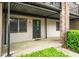 Inviting entrance with a covered porch and well-maintained landscaping at 3087 Colonial Way # J, Atlanta, GA 30341