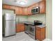 Well-equipped kitchen with stainless steel appliances and granite countertops at 3087 Colonial Way # J, Atlanta, GA 30341