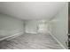 Spacious living room with gray wood-look floors and neutral paint at 3087 Colonial Way # J, Atlanta, GA 30341