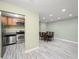 Spacious living area with open layout, seamlessly integrating the kitchen and dining space at 3087 Colonial Way # J, Atlanta, GA 30341