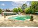 Community pool with ample space for relaxing and entertaining, surrounded by lush landscaping and mature trees at 3087 Colonial Way # J, Atlanta, GA 30341