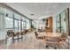 Elegant amenity space with tables, chairs, and floor-to-ceiling windows showcasing a great view at 3338 Peachtree Ne Rd # 2405, Atlanta, GA 30326