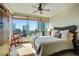 Bright bedroom with a ceiling fan and a large window showcasing city views at 3338 Peachtree Ne Rd # 2405, Atlanta, GA 30326