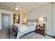 Bedroom features a stylish bed, bench seating, and a view into the bathroom at 3338 Peachtree Ne Rd # 2405, Atlanta, GA 30326