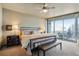 Bedroom boasts a sitting area and balcony access with incredible city views at 3338 Peachtree Ne Rd # 2405, Atlanta, GA 30326