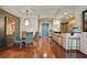 Dining area with modern lighting, bar seating, and easy access to the kitchen at 3338 Peachtree Ne Rd # 2405, Atlanta, GA 30326