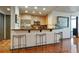 Kitchen bar features stainless steel appliances, contemporary bar seating, and artwork at 3338 Peachtree Ne Rd # 2405, Atlanta, GA 30326