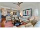 Comfortable living room featuring a ceiling fan, plush seating, and artistic accents at 3338 Peachtree Ne Rd # 2405, Atlanta, GA 30326