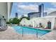 Inviting outdoor pool with lounge chairs and a scenic city backdrop at 3338 Peachtree Ne Rd # 2405, Atlanta, GA 30326